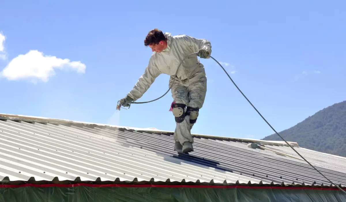 A-man-Sparying-Roof-Sealing and cleaning