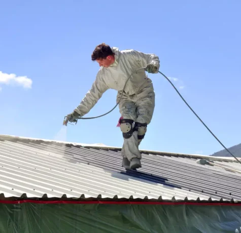 A-man-Sparying-Roof-Sealing and cleaning